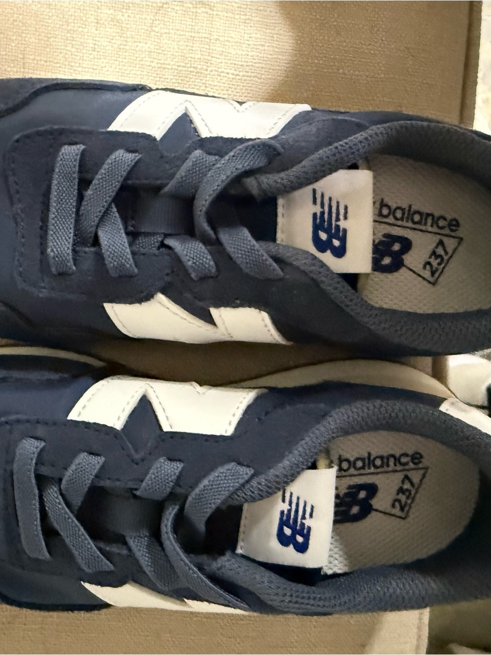 New Balance Kids Navy Blue and White Sneakers